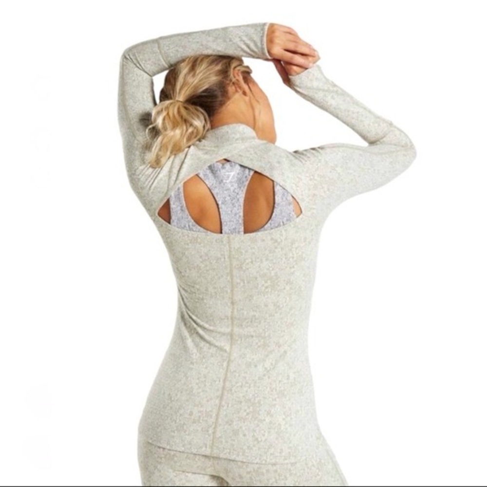 Gymshark khaki marl fleur texture half zip with cross open back.